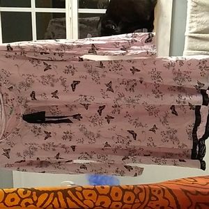 An extra large pink dress with butterflies and flowers